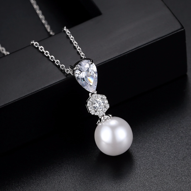 Sina - Elegant cubic zirconia pearl bridal earrings