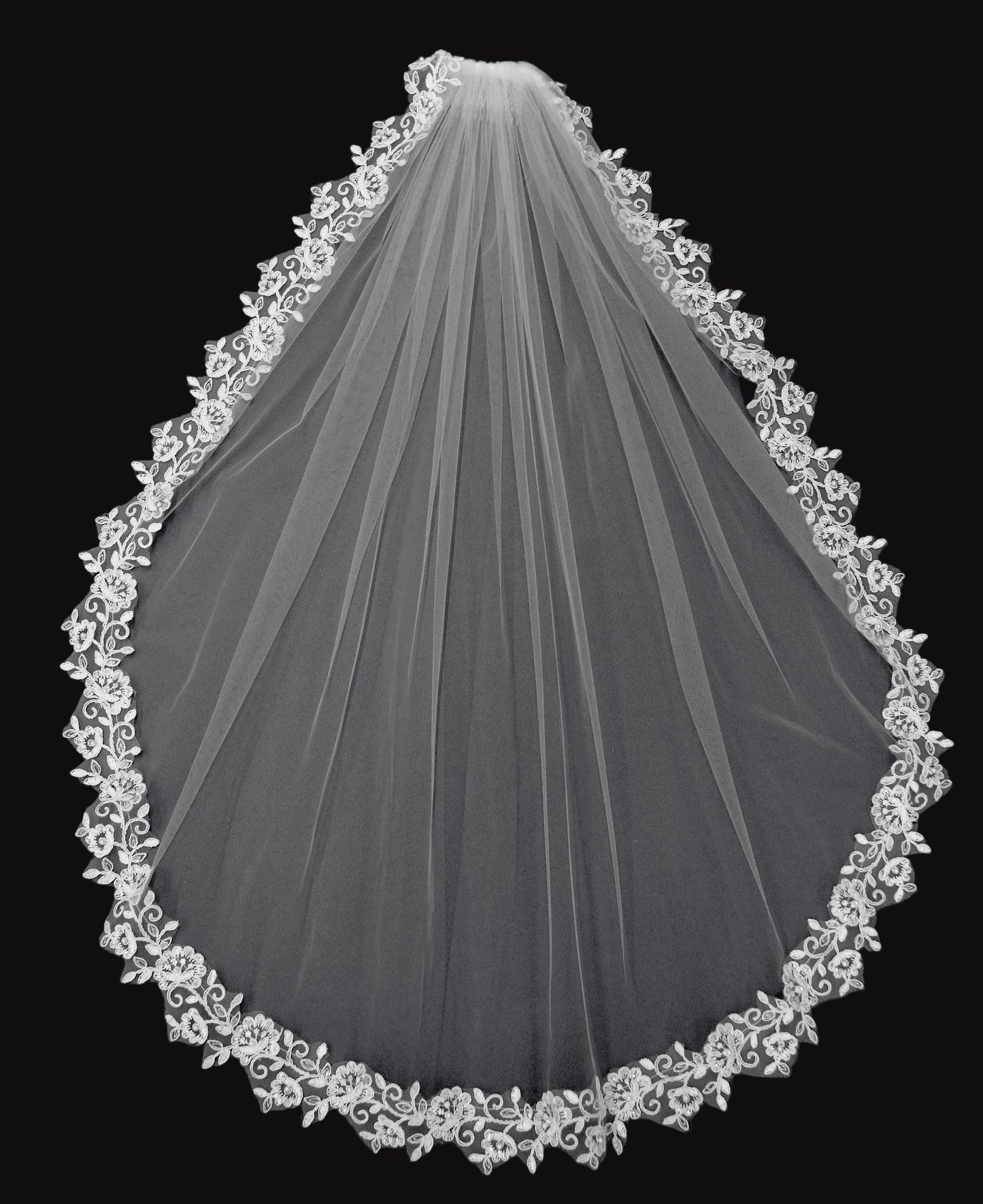 White wedding veil with lace edge on a black background
